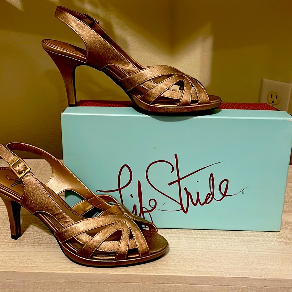 Gold strapped heel.